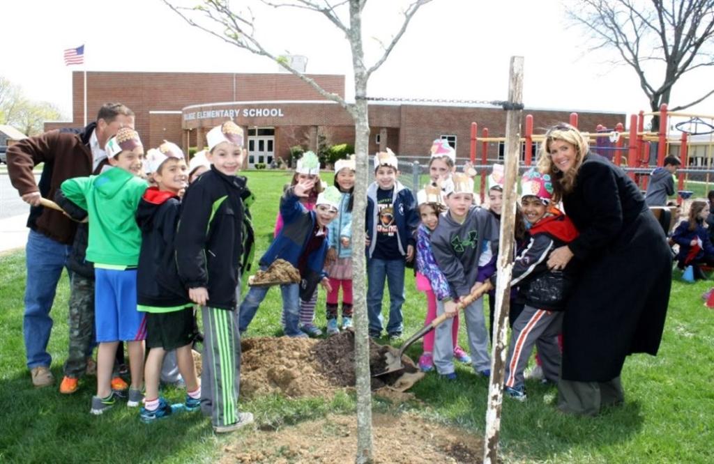 Freeholder Deputy Director Serena DiMaso plants a tree with second grade students at Village School to celebrate Arbor Day on April 24 in Holmdel, NJ.